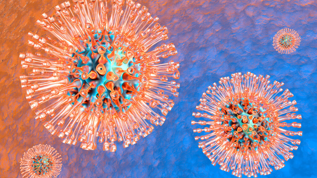 Image microscopique colorée de particules virales ressemblant à des hérissons.